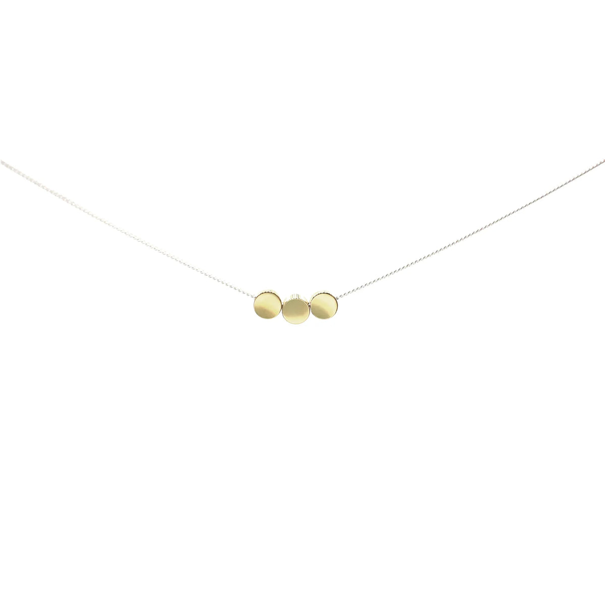 The Rarara Necklace features three small, gold round discs on a thin sterling silver chain, arranged side by side against a white background—ideal for lovers of handmade jewelry.