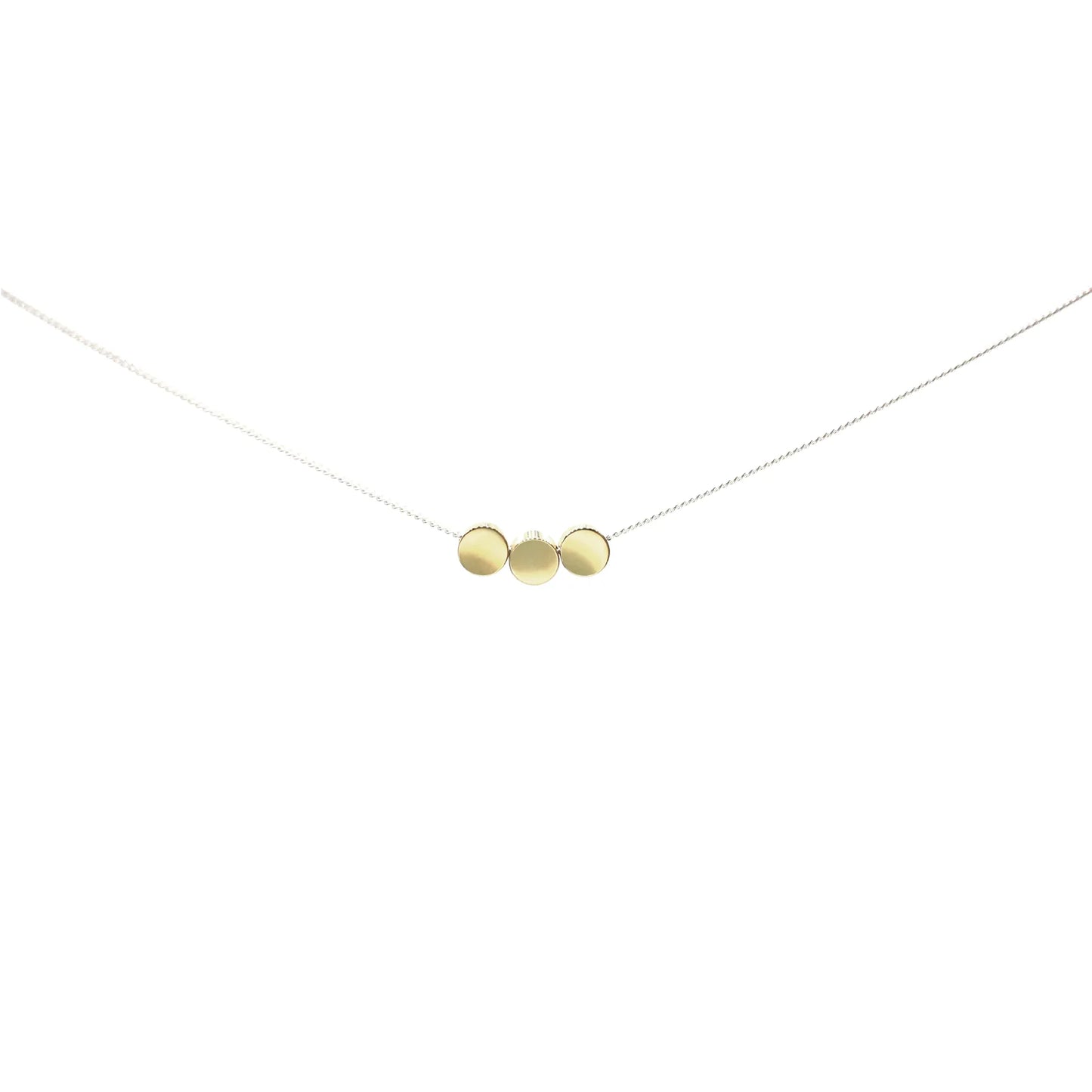 The Rarara Necklace features three small, gold round discs on a thin sterling silver chain, arranged side by side against a white background—ideal for lovers of handmade jewelry.