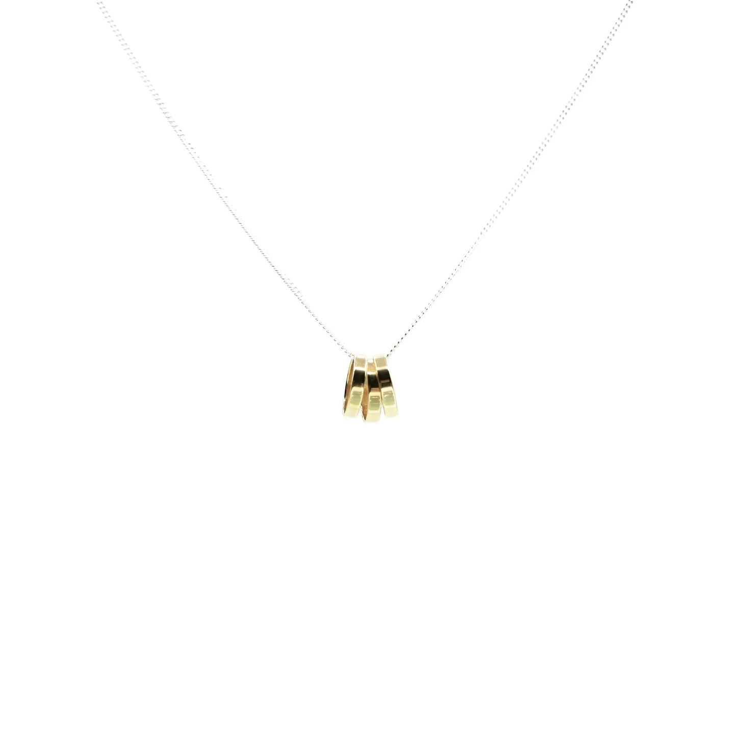 The Seeing Under Water Necklace features a delicate silver chain with three small rectangular gold pendants grouped at the center, embodying minimalistic jewelry style against a plain white background.
