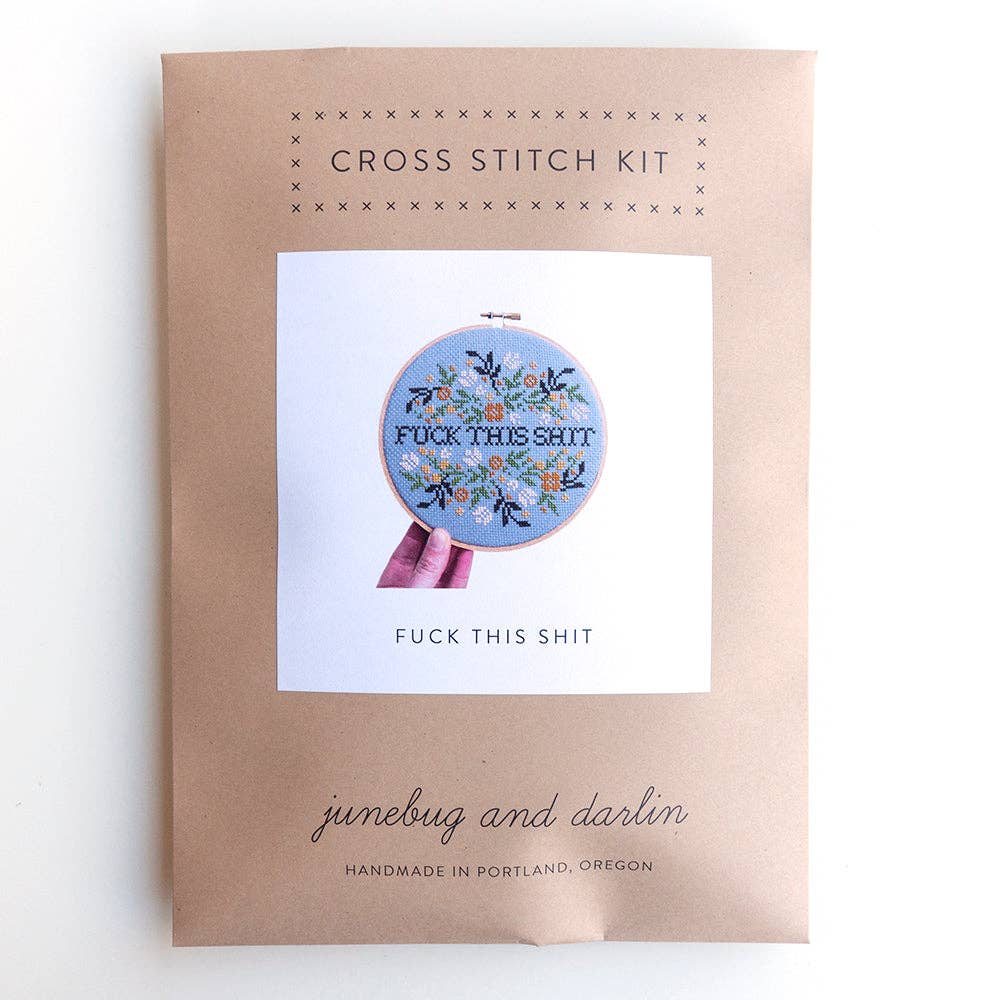 The Fuck This Shit Cross Stitch Kit features a floral design with “FUCK THIS SHIT” text. Handmade in Portland by junebug and darlin, it’s perfect for beginners and includes everything needed to complete the project.