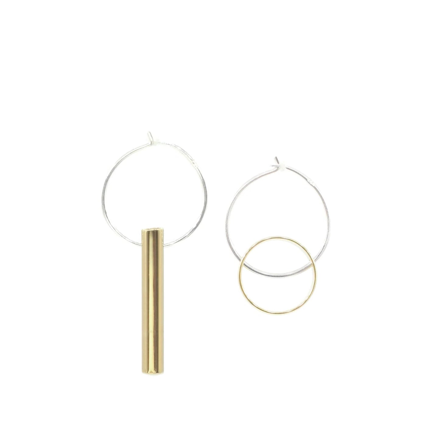 The Hello Halo & Ray Earrings are unique mismatched handmade earrings: one has a silver hoop with a vertical gold cylinder, the other features a silver hoop with a small gold hoop inside. Crafted in Cape Town, displayed on a plain white background.