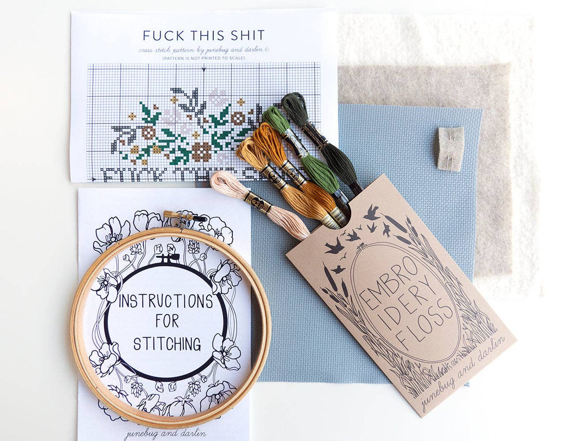 The Fuck This Shit Cross Stitch Kit is a beginner-friendly, handmade kit from Portland. It includes a hoop, fabric, colored floss, instructions, and the bold “FUCK THIS SHIT” pattern on white.