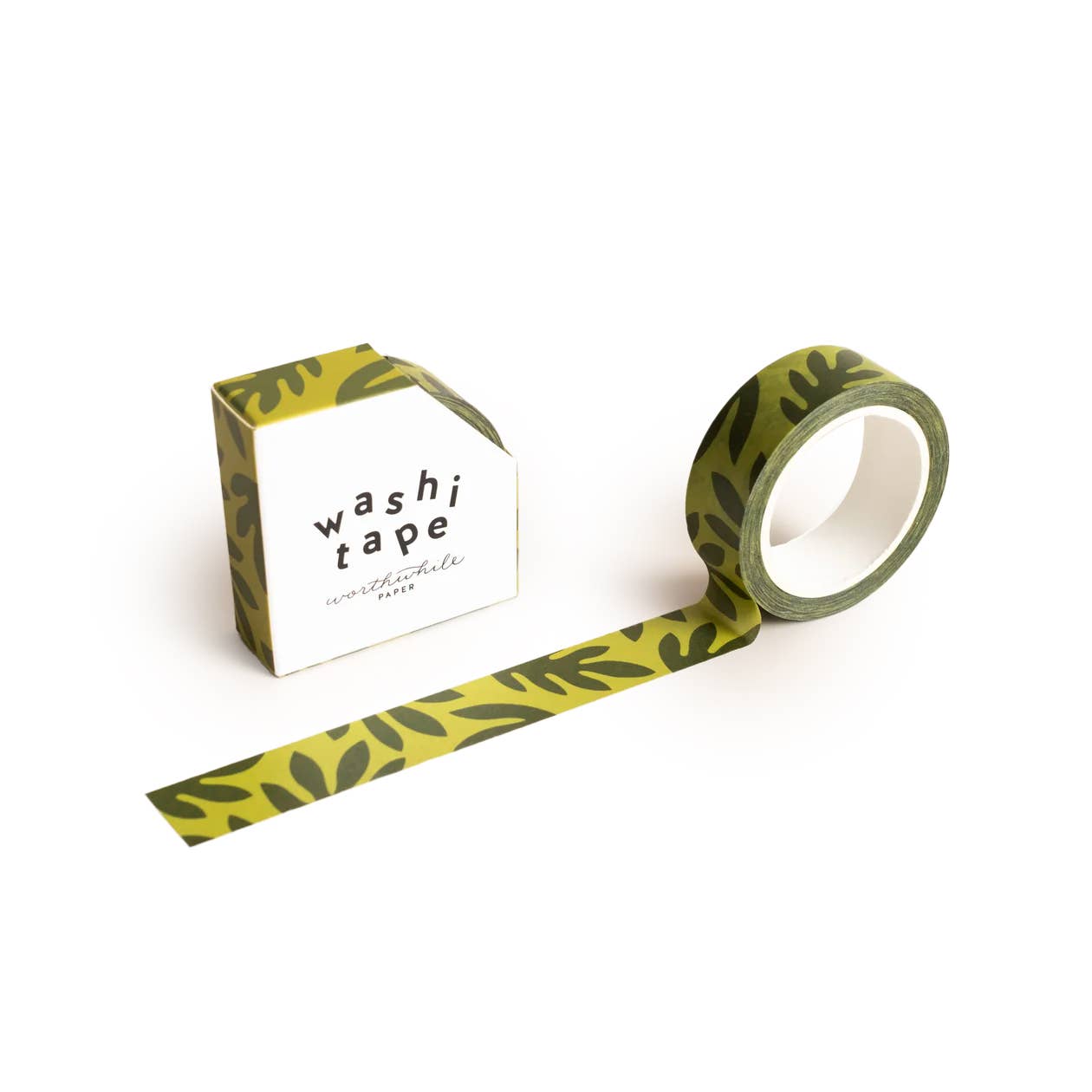 The Lush Leaves Pattern Washi Tape, featuring a dark green plant motif, is partially unrolled beside its eco-friendly box labeled “washi tape” in bold black text on a white background.