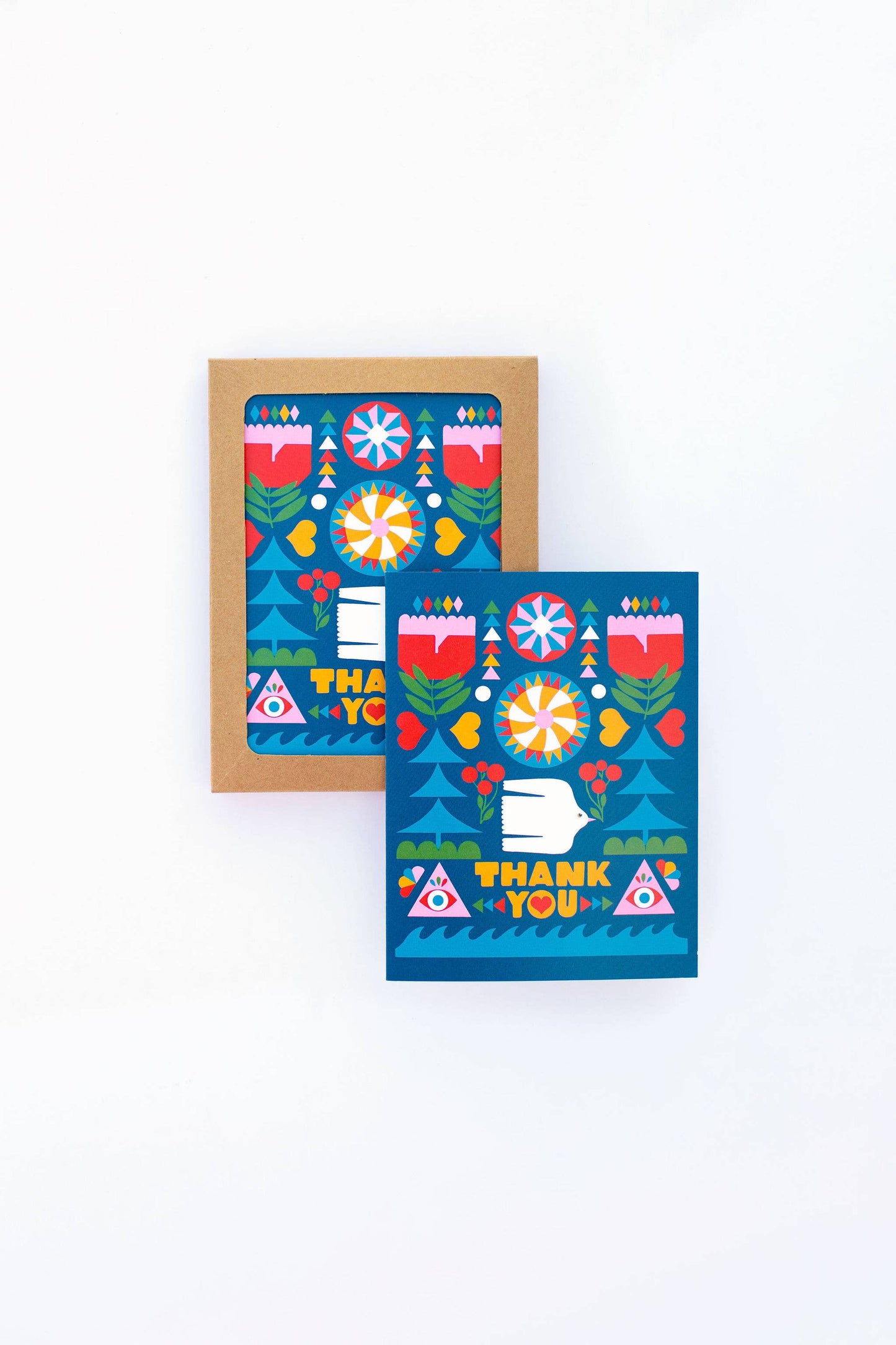 Folk Flowers Thank You Greeting Card shown in a brown envelope and on display, features Lisa Congdon-inspired folk art floral designs with blue backgrounds, and red, yellow, and pink accents on a white surface.