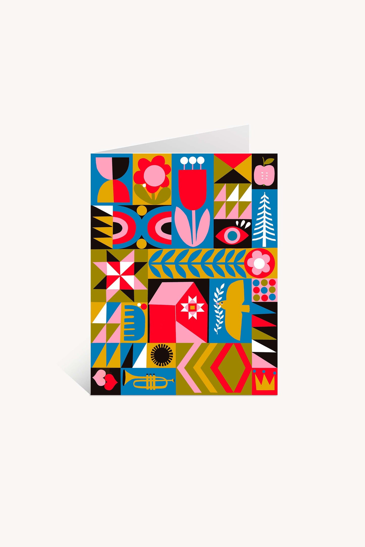 The Blank Quilt Squares Greeting Card features bold geometric shapes, flowers, leaves, birds, and abstract patterns in vibrant red, pink, blue, yellow, and black on a white background.