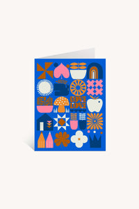 The Love Love Mushroom Greeting Card features a blue background with colorful geometric shapes, flowers, mushrooms, hearts, rainbows, and "LOVE LOVE" in the center—perfect for fans of folk-inspired and Lisa Congdon-style art.