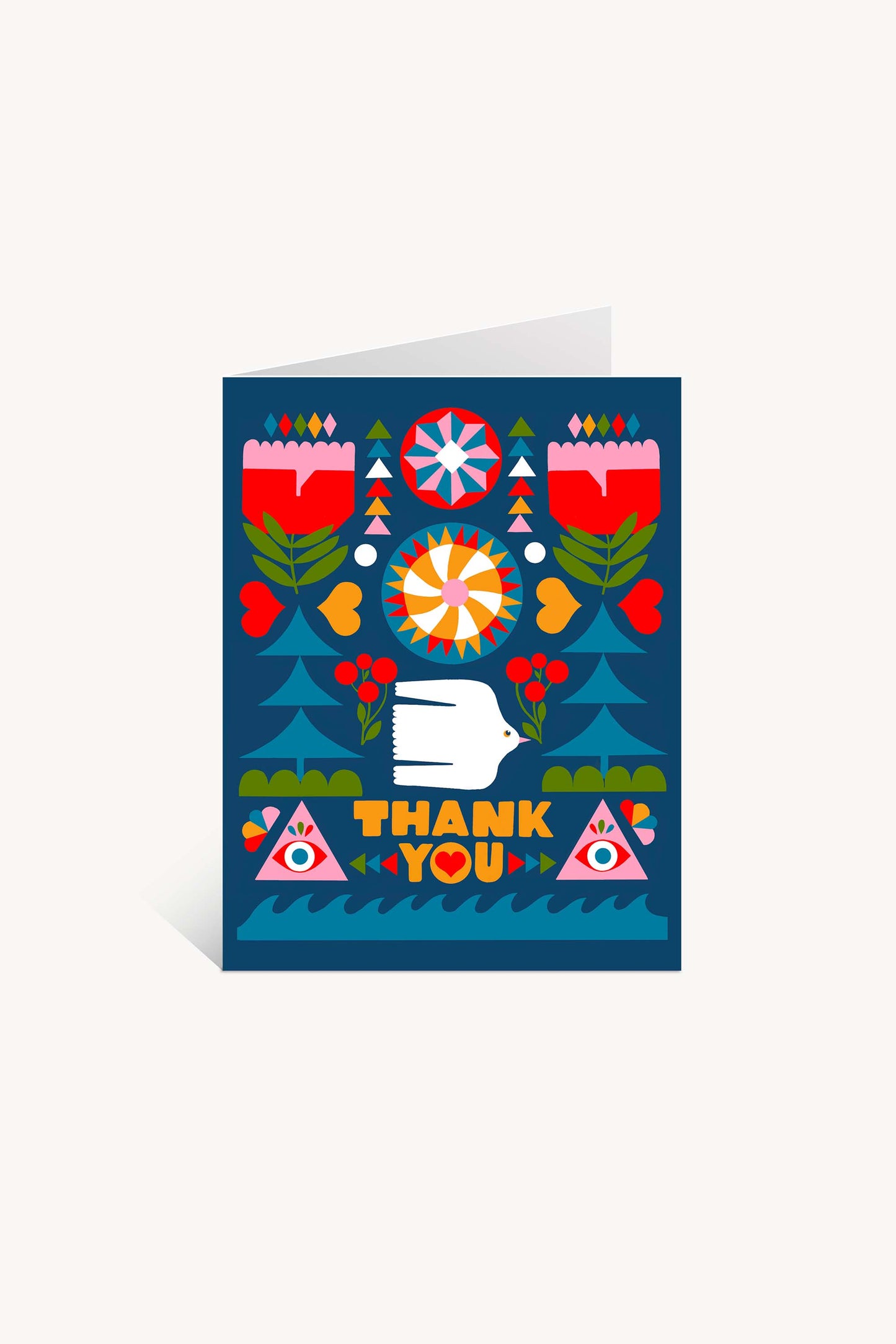 The Folk Flowers Thank You Greeting Card by Lisa Congdon features floral and geometric folk art, a white hand, red hearts, two eyes in triangles, and bold yellow “THANK YOU” letters on a deep blue background.