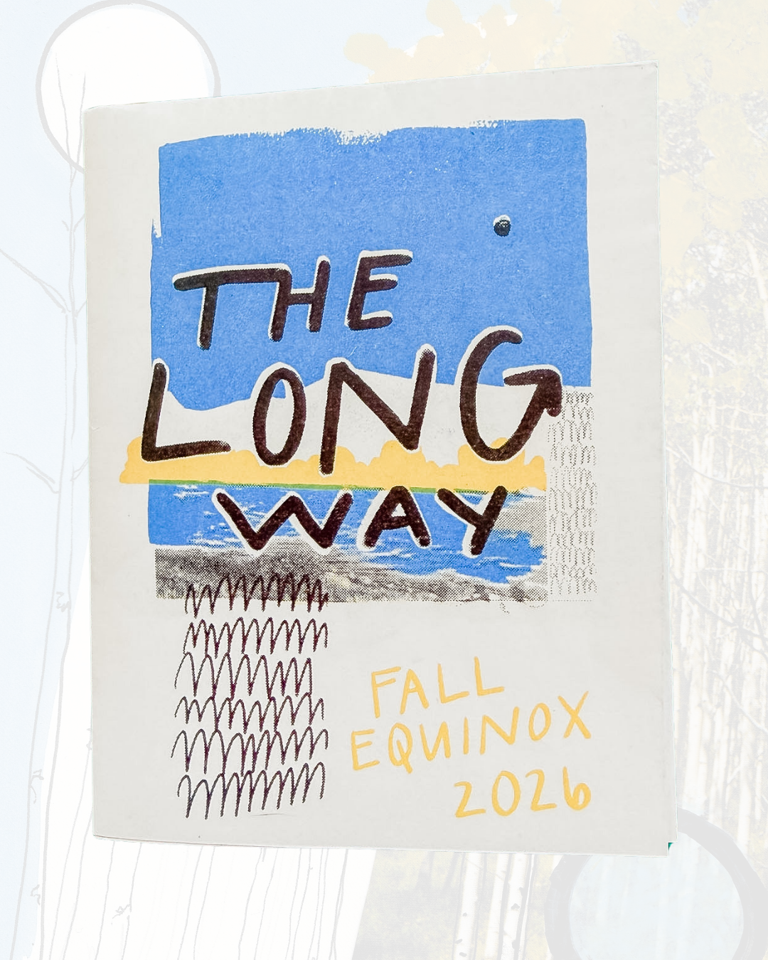 A hand-drawn poster for The Long Way | Fall Equinox Zine features the title against a blue sky with water and abstract patterns, complemented by faint trees in the background. “FALL EQUINOX 2026” appears in yellow below, capturing the spirit of original artwork and creative inspiration perfect for a quarterly zine.