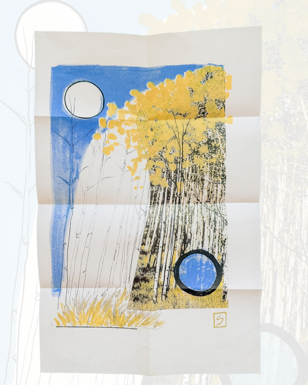Colorful artwork from The Long Way | Fall Equinox Zine features tall, slender trees with yellow leaves on the right beneath a blue sky. Two black-rimmed circles—one in the sky and another among the foliage—add intrigue to the scene. Visible fold lines throughout the paper evoke the original charm characteristic of this quarterly zine.