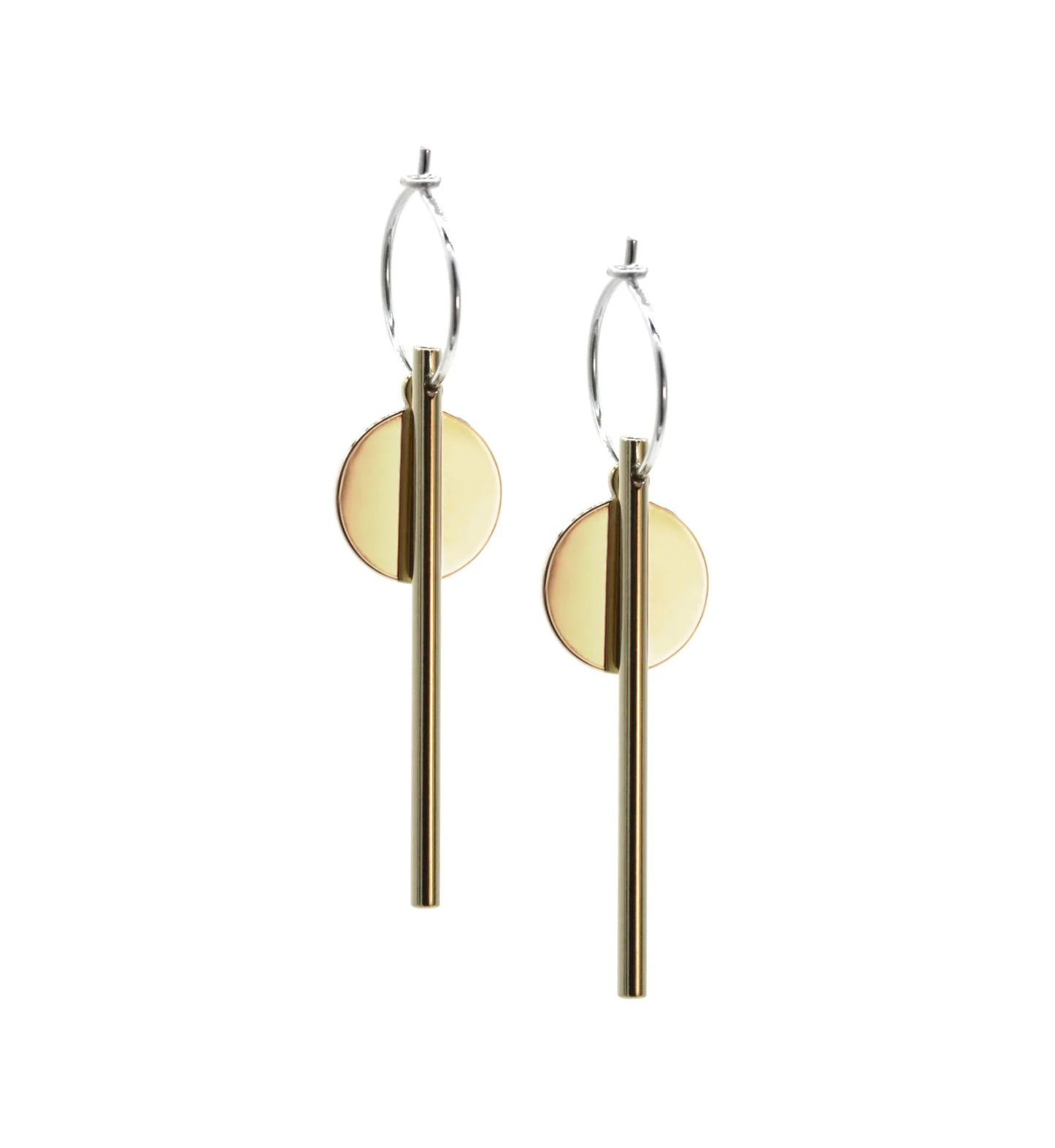 The Rising Sun Earrings are modern handmade jewelry featuring sterling silver hoops, vertical gold rods, and flat circular gold discs hanging behind the rods.