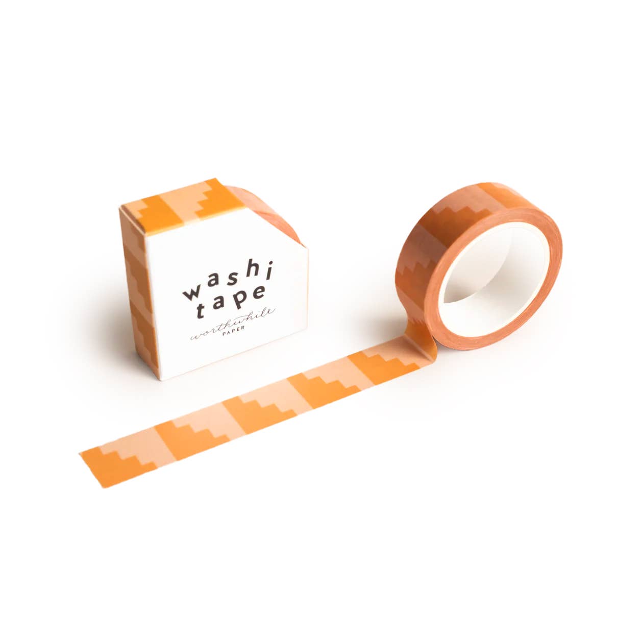 The Colorblock Steps Washi Tape, featuring an orange geometric zigzag pattern, is partially unrolled beside its matching eco-friendly box, which displays a similar orange design and is labeled washi tape.
