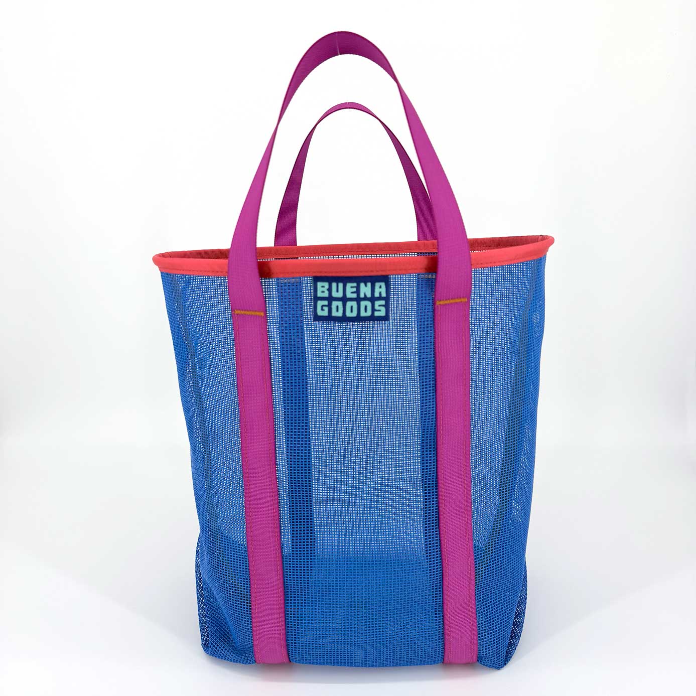 The Go Getter | Yacht Rock is a blue plastic mesh tote bag with pink handles, trim, and a Buena Goods label, shown as a reusable shopping bag against a plain white background.